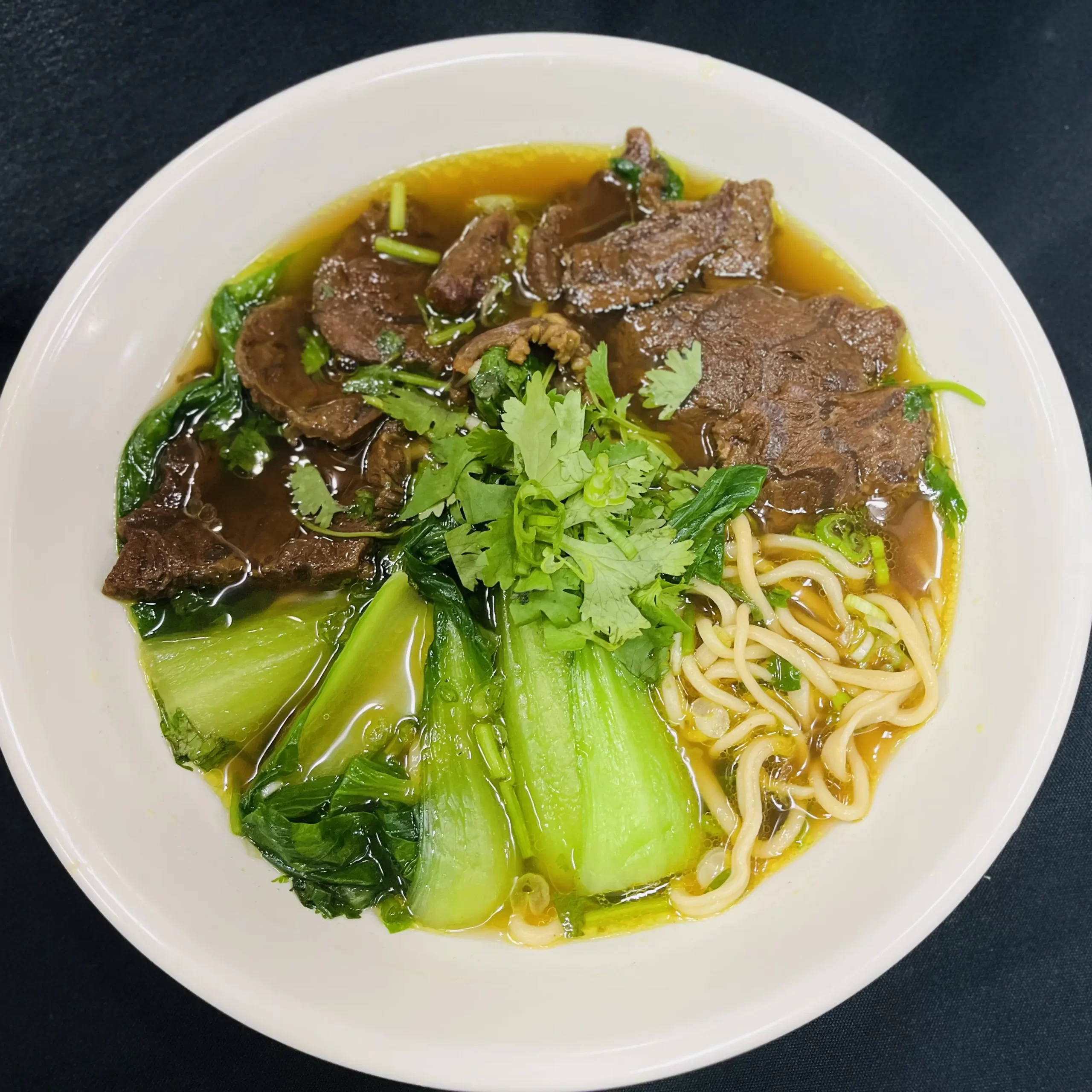 Tender beef shank with noodles in savory broth at Wonderful Hand-Pulled Noodle，a Chinese Noodle Restaurant in Orlando