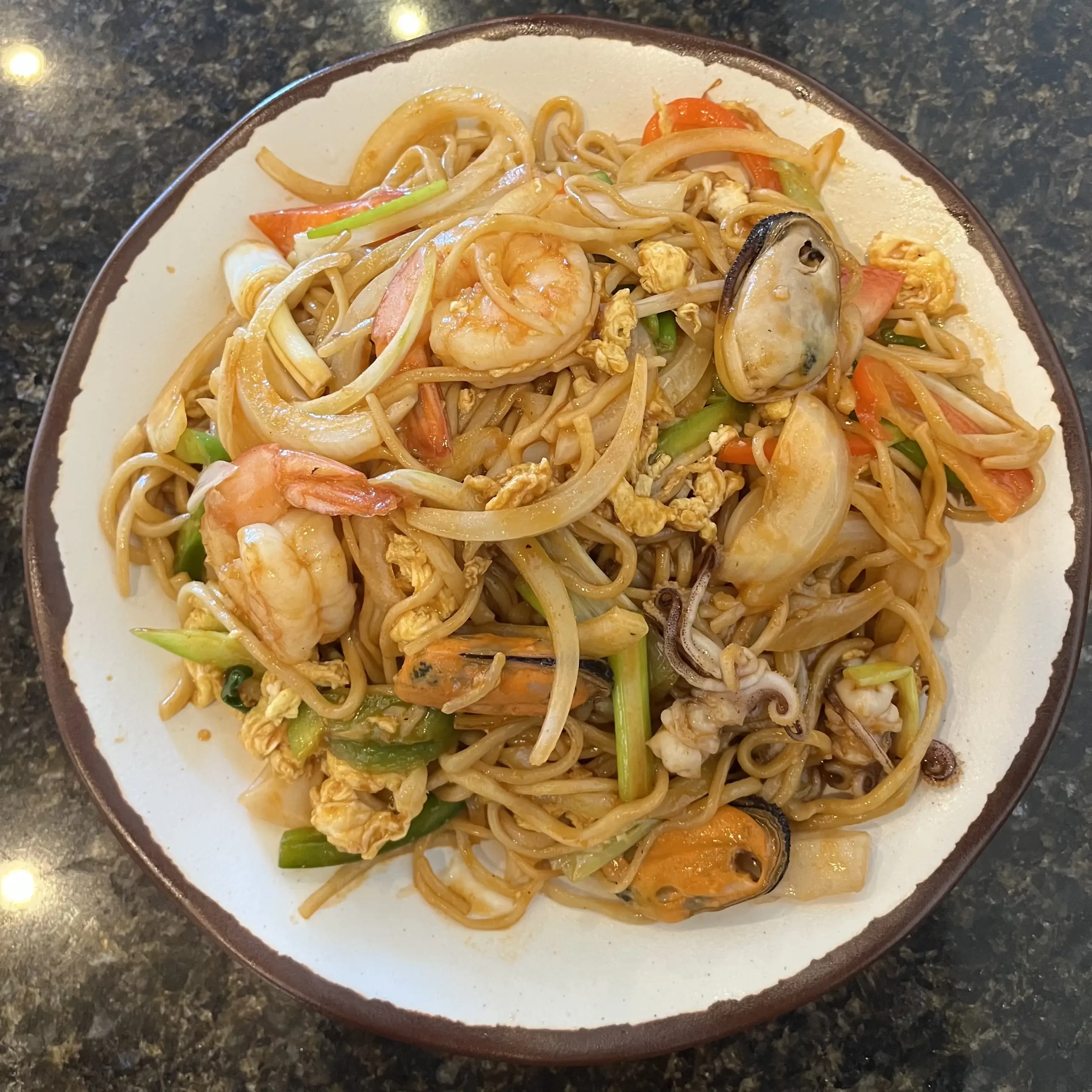 Seafood Stir-fried Noodle – Stir-fried noodles with mixed seafood and veggies Stir-fried noodles with mixed seafood and veggies at Wonderful Hand-Pulled Noodle,a Chinese Noodle Restaurant in Orlando
